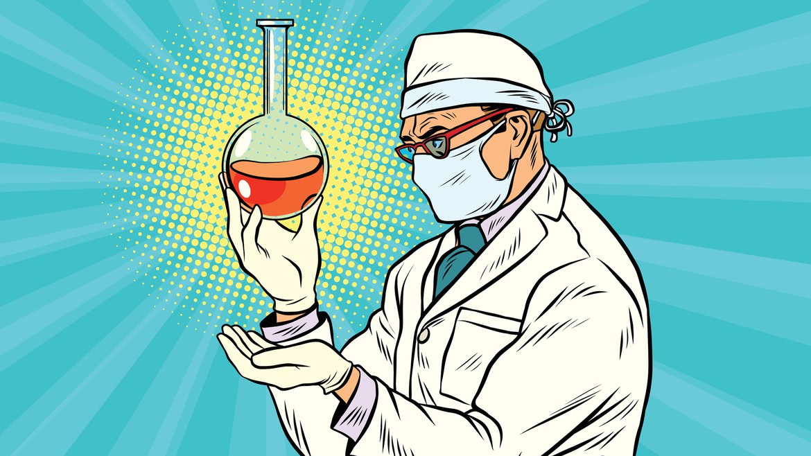 Ein Wissenschaftler mit einem Reagenzglas in der Hand
