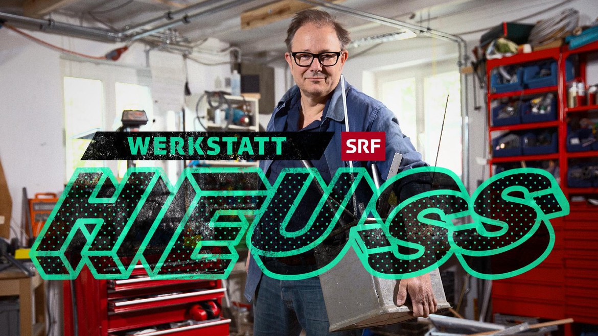 Keyframe «Werkstatt Heuss»: Stefan Heuss steht in seiner Werkstatt und blickt in die Kamera.